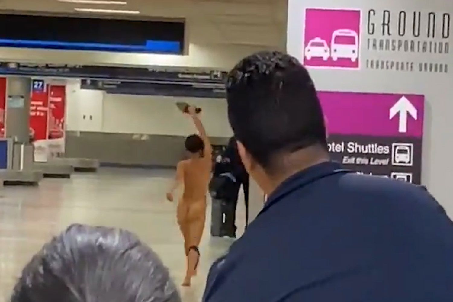 Woman arrested after naked, delusional spree in Miami airport - NZ Herald