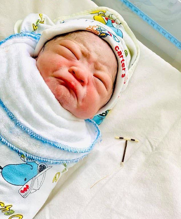 Life Finds A Way Newborn Baby Pictured Holding Iud Nz Herald