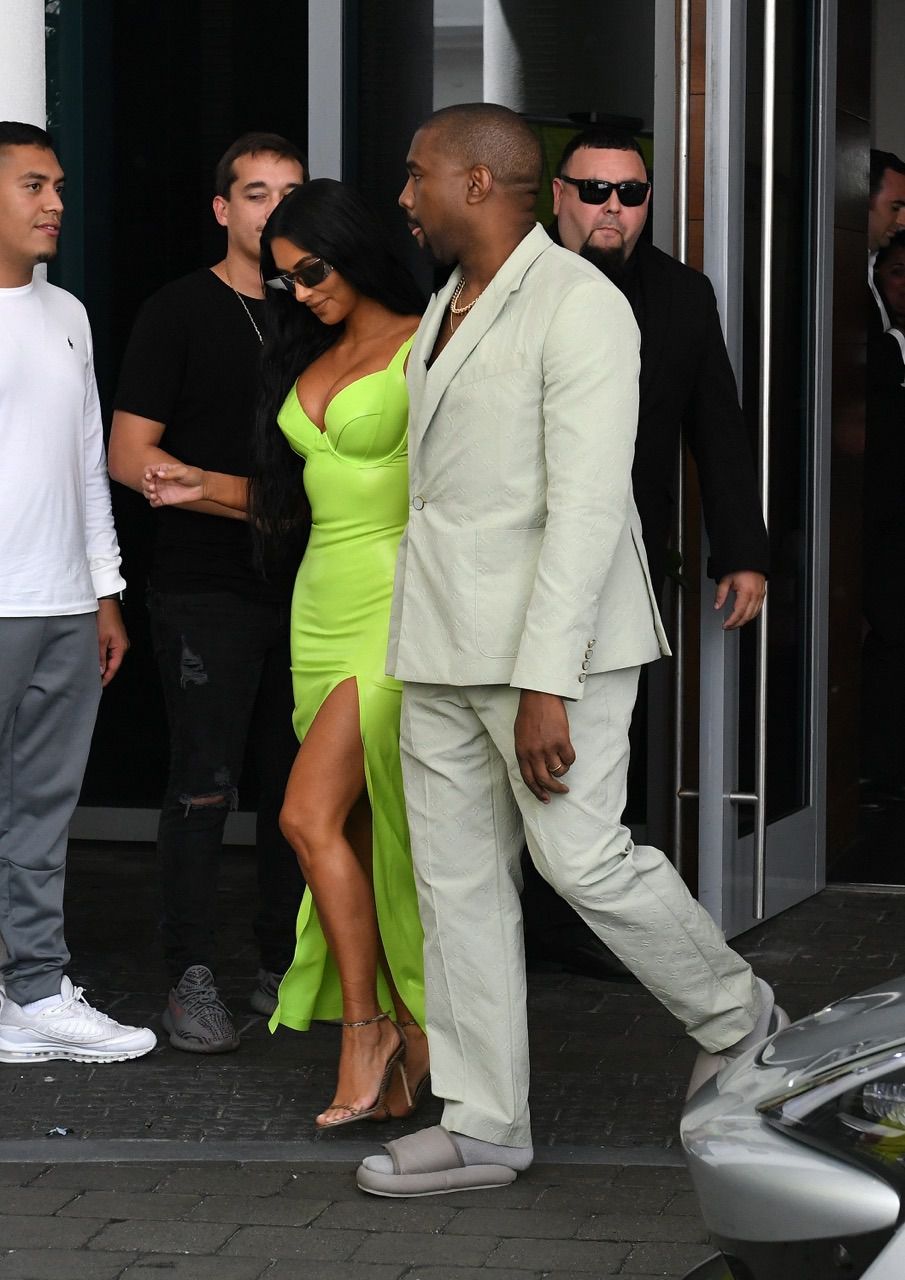 Kanye West ridiculed for wearing tiny Yeezy slides and socks to wedding -  NZ Herald