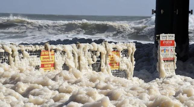 Sea foam swamps Australian beaches amid spell of extreme weather