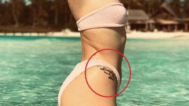 Jessie J defends misspelled tattoo and 'small boobs' in bikini photo